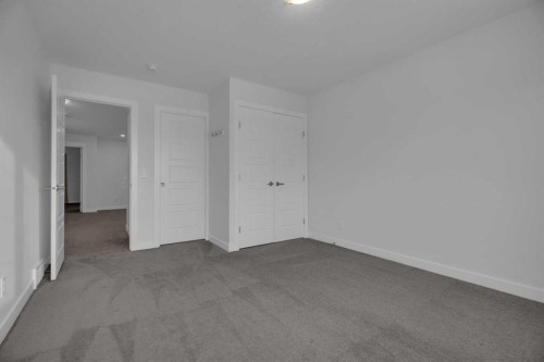 #208 Dawson Harbour Heights, Chestermere, AB - Indoor Photo Showing Other Room