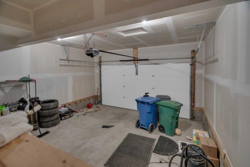 #208 Dawson Harbour Heights, Chestermere, AB - Indoor Photo Showing Garage