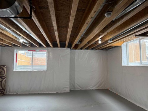 #208 Dawson Harbour Heights, Chestermere, AB - Indoor Photo Showing Basement