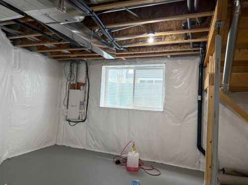 #208 Dawson Harbour Heights, Chestermere, AB - Indoor Photo Showing Basement