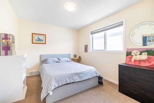 436 Cimarron Boulevard, Okotoks, AB - Indoor Photo Showing Bedroom