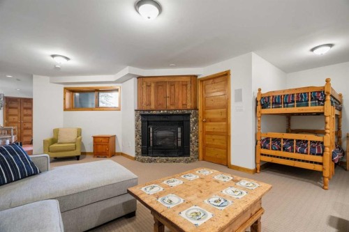 1021 Rundleview Drive, Canmore, AB - Indoor Photo Showing Living Room With Fireplace