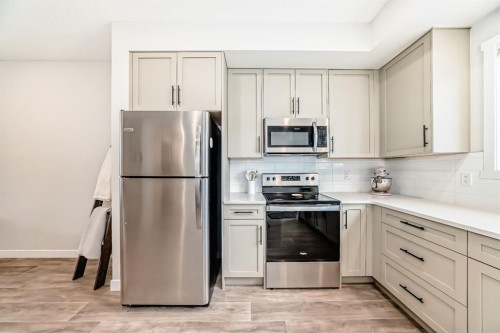 36 Carringvue Way Nw, Calgary, AB - Indoor Photo Showing Kitchen With Stainless Steel Kitchen