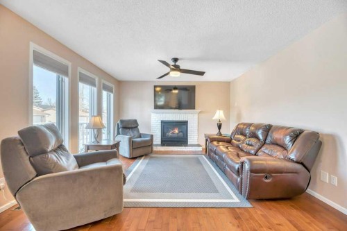 11 Maple Garden, Strathmore, AB - Indoor Photo Showing Living Room With Fireplace