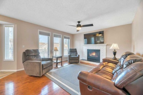 11 Maple Garden, Strathmore, AB - Indoor Photo Showing Living Room With Fireplace