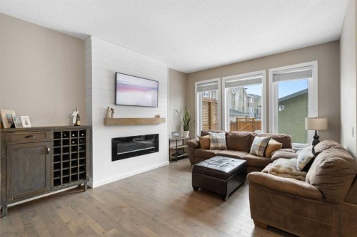 41 Marquis Common Se, Calgary, AB - Indoor Photo Showing Living Room With Fireplace
