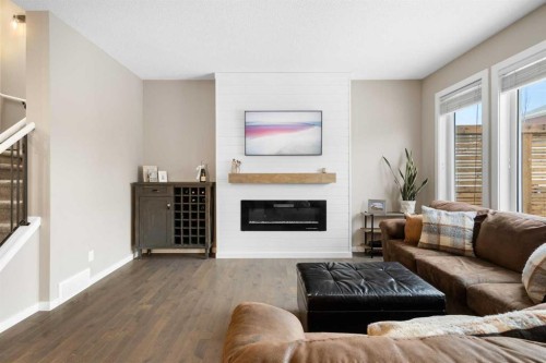 41 Marquis Common Se, Calgary, AB - Indoor Photo Showing Living Room With Fireplace