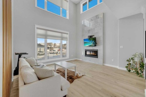 23 Coutts Close, Olds, AB - Indoor Photo Showing Living Room With Fireplace