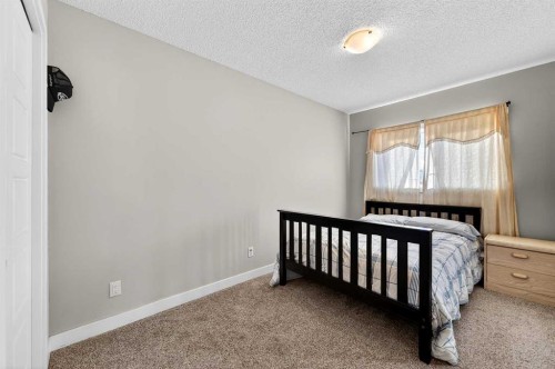 312 Martin Crossing Way Ne, Calgary, AB - Indoor Photo Showing Bedroom