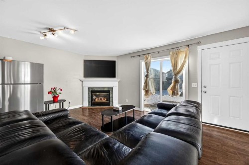 312 Martin Crossing Way Ne, Calgary, AB - Indoor Photo Showing Living Room With Fireplace