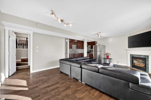 312 Martin Crossing Way Ne, Calgary, AB - Indoor Photo Showing Living Room With Fireplace