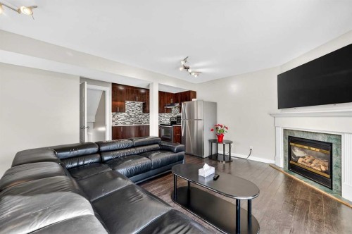 312 Martin Crossing Way Ne, Calgary, AB - Indoor Photo Showing Living Room With Fireplace