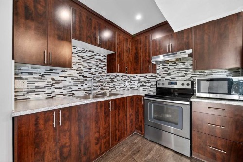 312 Martin Crossing Way Ne, Calgary, AB - Indoor Photo Showing Kitchen With Stainless Steel Kitchen With Double Sink With Upgraded Kitchen