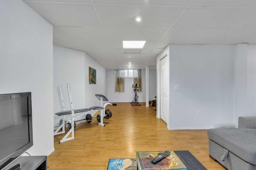 97 Everwillow Close Sw, Calgary, AB - Indoor Photo Showing Gym Room
