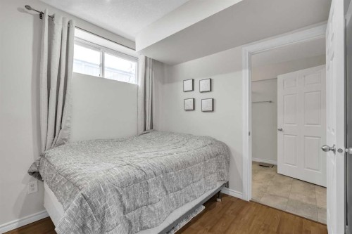 97 Everwillow Close Sw, Calgary, AB - Indoor Photo Showing Bedroom