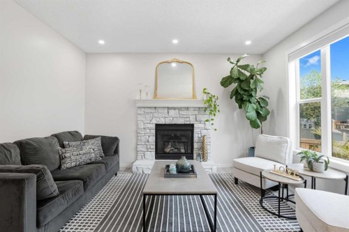270 Everoak Drive Sw, Calgary, AB - Indoor Photo Showing Living Room With Fireplace