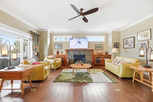 4 Bridle Estates Road Sw, Calgary, AB - Indoor Photo Showing Living Room With Fireplace