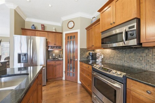 4 Bridle Estates Road Sw, Calgary, AB - Indoor Photo Showing Kitchen With Upgraded Kitchen