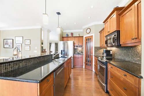 4 Bridle Estates Road Sw, Calgary, AB - Indoor Photo Showing Kitchen With Upgraded Kitchen