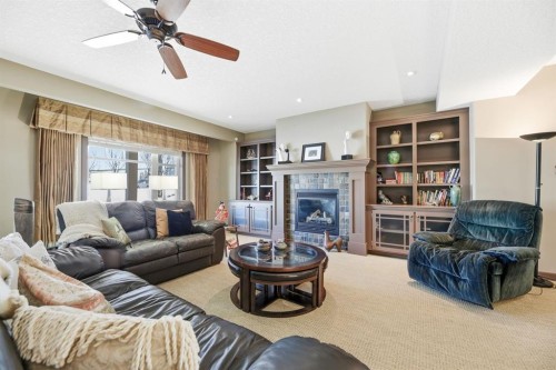 4 Bridle Estates Road Sw, Calgary, AB - Indoor Photo Showing Living Room With Fireplace