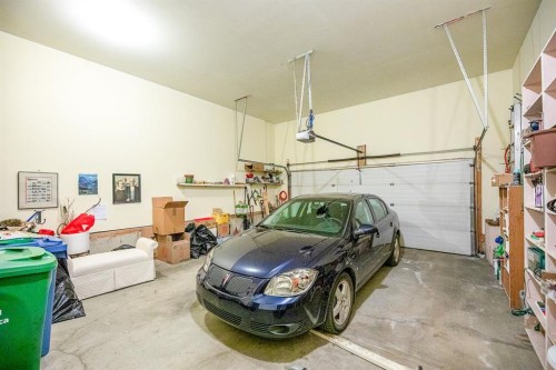 4 Bridle Estates Road Sw, Calgary, AB - Indoor Photo Showing Garage