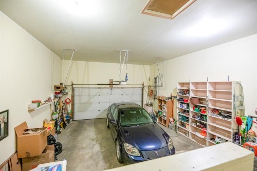 4 Bridle Estates Road Sw, Calgary, AB - Indoor Photo Showing Garage