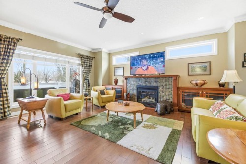 4 Bridle Estates Road Sw, Calgary, AB - Indoor Photo Showing Living Room With Fireplace