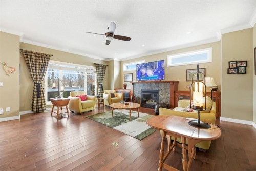 4 Bridle Estates Road Sw, Calgary, AB - Indoor Photo Showing Living Room With Fireplace