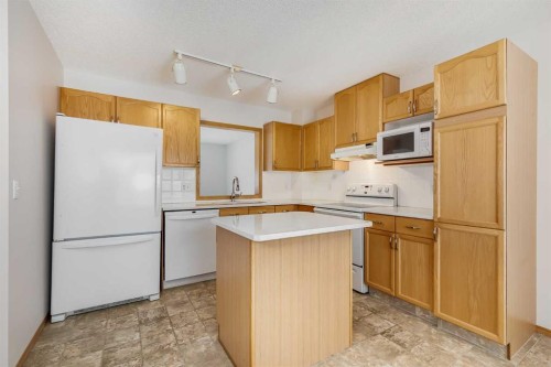 153 Rocky Ridge Court Nw, Calgary, AB - Indoor Photo Showing Kitchen