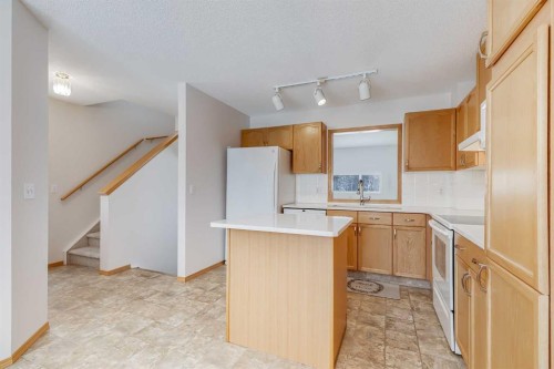 153 Rocky Ridge Court Nw, Calgary, AB - Indoor Photo Showing Kitchen