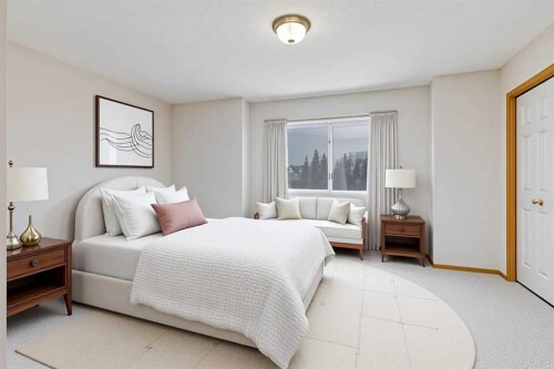 153 Rocky Ridge Court Nw, Calgary, AB - Indoor Photo Showing Bedroom