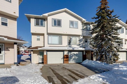 153 Rocky Ridge Court Nw, Calgary, AB - Outdoor With Facade