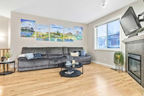 48 Tucker Circle, Okotoks, AB - Indoor Photo Showing Living Room With Fireplace
