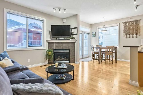 48 Tucker Circle, Okotoks, AB - Indoor Photo Showing Living Room With Fireplace
