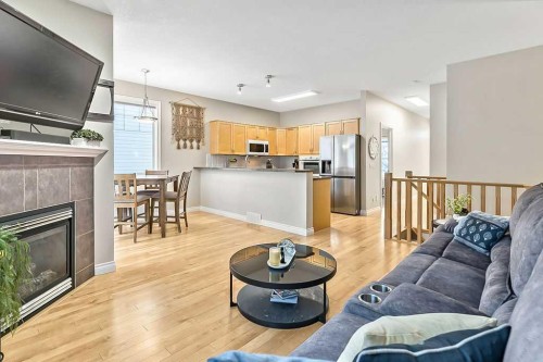 48 Tucker Circle, Okotoks, AB - Indoor Photo Showing Living Room With Fireplace