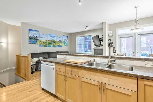 48 Tucker Circle, Okotoks, AB - Indoor Photo Showing Kitchen With Double Sink