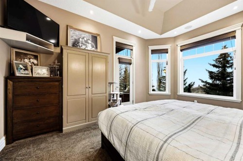140 Gleneagles Landing, Cochrane, AB - Indoor Photo Showing Bedroom