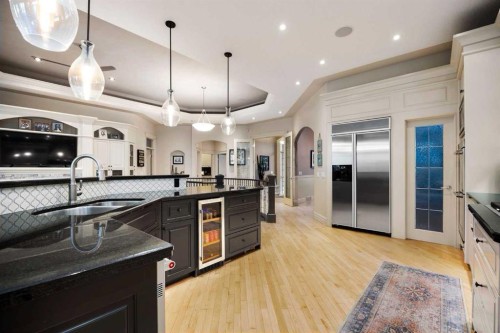 140 Gleneagles Landing, Cochrane, AB - Indoor Photo Showing Kitchen With Double Sink With Upgraded Kitchen