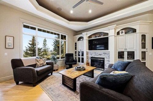 140 Gleneagles Landing, Cochrane, AB - Indoor Photo Showing Living Room With Fireplace