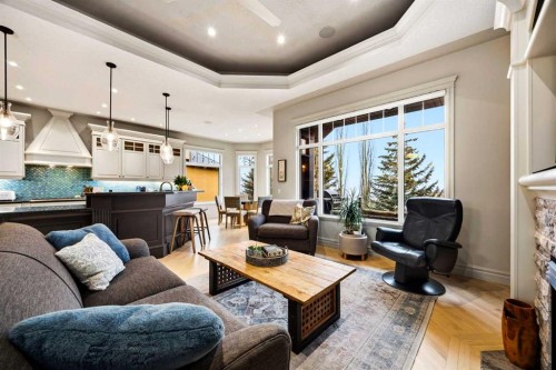 140 Gleneagles Landing, Cochrane, AB - Indoor Photo Showing Living Room With Fireplace