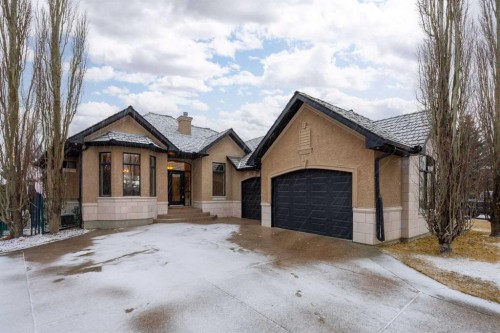 140 Gleneagles Landing, Cochrane, AB - Outdoor With Facade