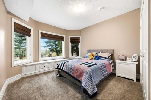 140 Gleneagles Landing, Cochrane, AB - Indoor Photo Showing Bedroom
