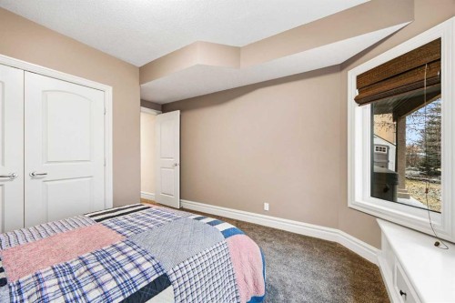 140 Gleneagles Landing, Cochrane, AB - Indoor Photo Showing Bedroom