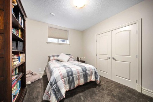 140 Gleneagles Landing, Cochrane, AB - Indoor Photo Showing Bedroom