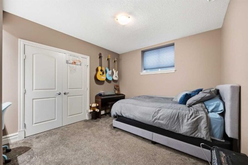 140 Gleneagles Landing, Cochrane, AB - Indoor Photo Showing Bedroom
