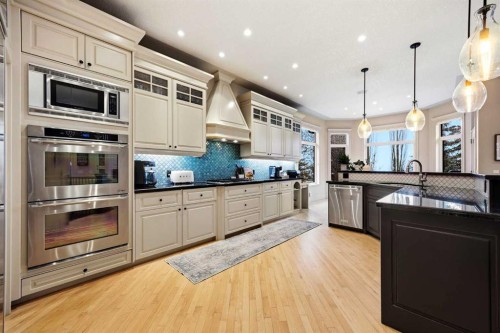 140 Gleneagles Landing, Cochrane, AB - Indoor Photo Showing Kitchen With Upgraded Kitchen