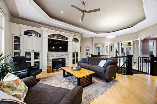 140 Gleneagles Landing, Cochrane, AB - Indoor Photo Showing Living Room With Fireplace
