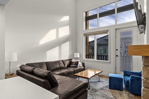 402-1315 Spring Creek Gate, Canmore, AB - Indoor Photo Showing Living Room