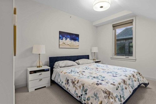 402-1315 Spring Creek Gate, Canmore, AB - Indoor Photo Showing Bedroom