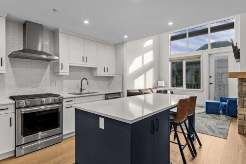 402-1315 Spring Creek Gate, Canmore, AB - Indoor Photo Showing Kitchen With Upgraded Kitchen